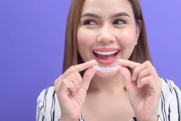 Young Smiling Woman Holding Invisalign Braces Studio Dental Healthcare Orthodontic — Foto Stock