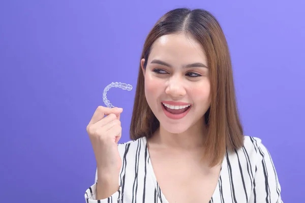 Young Smiling Woman Holding Invisalign Braces Studio Dental Healthcare Orthodontic — 图库照片