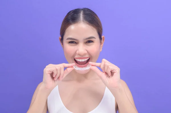 Young Smiling Woman Holding Invisalign Braces Studio Dental Healthcare Orthodontic — Φωτογραφία Αρχείου