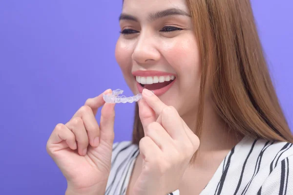 Young Smiling Woman Holding Invisalign Braces Studio Dental Healthcare Orthodontic — Foto Stock