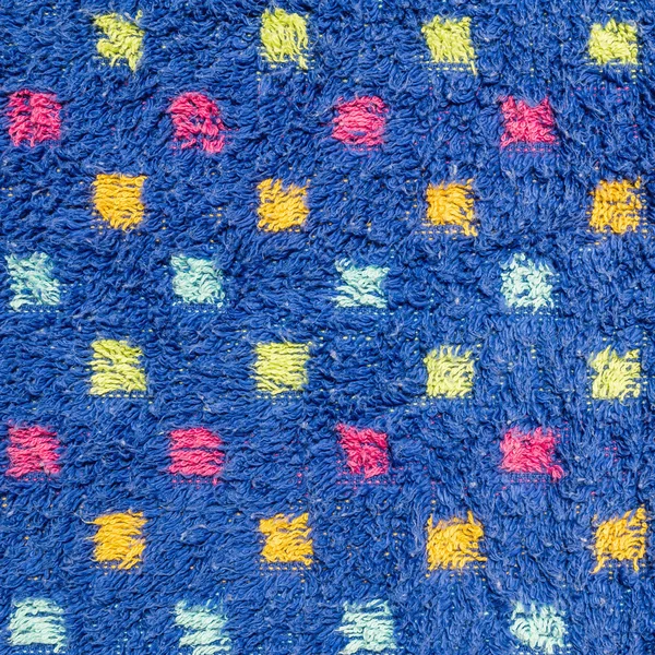Ткань крупным планом на старом коврике с красочным фоном точечной текстуры — стоковое фото