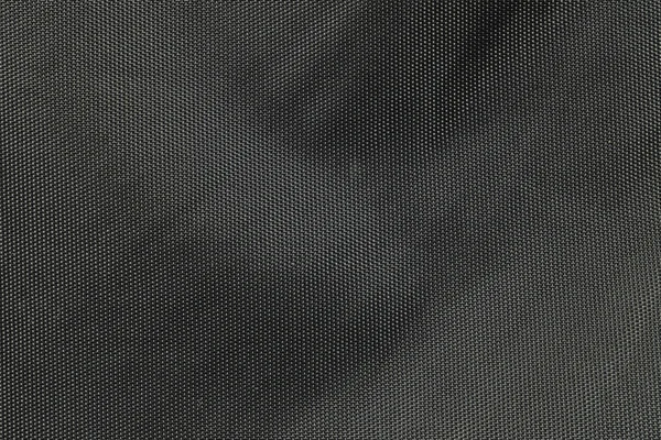 Nahaufnahme Stoff auf dem schwarzen Taschenhintergrund — Stockfoto