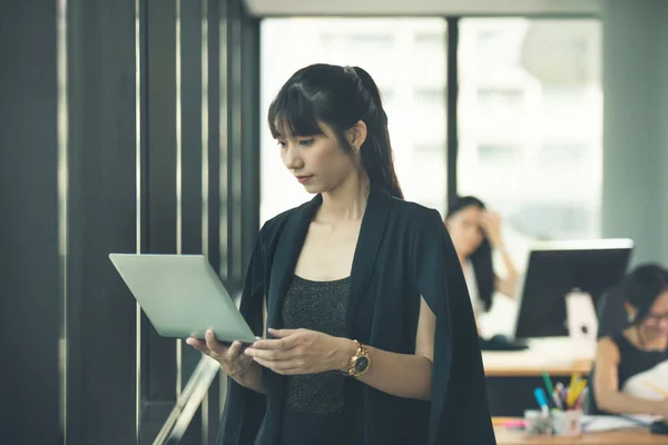 young asia business woman working together in office space. Asian business people group meeting room conference desk real office team