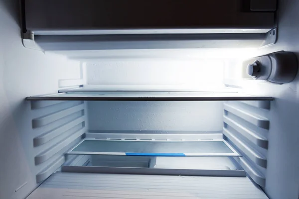 empty refrigerator, many empty shelves in the refrigerator