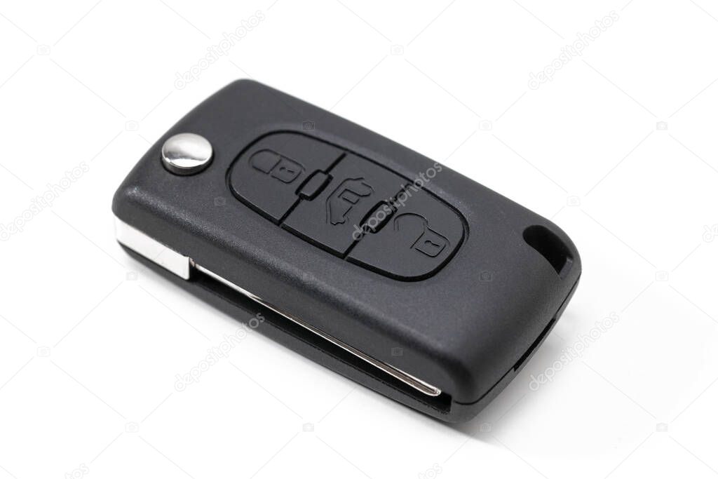 Modern car key with remote control lock isolated on white