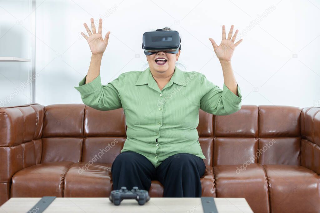 senior woman enjoying when wearing VR headsets