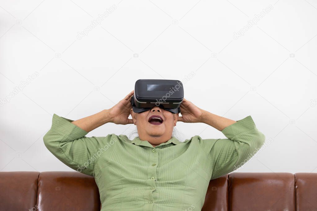 senior woman enjoying when wearing VR headsets