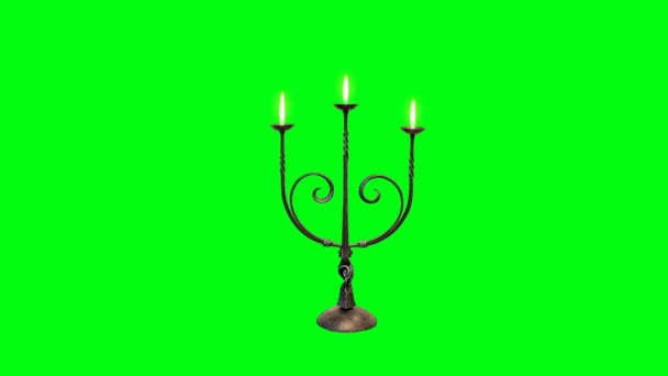 Свеча с пламенем на зеленом фоне — стоковое видео