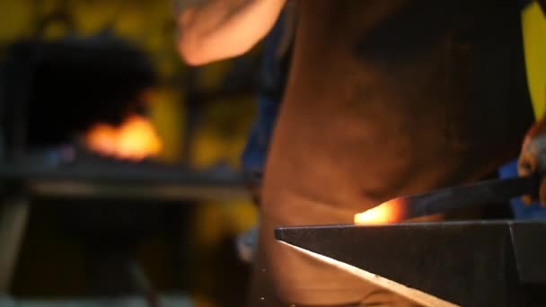 Blacksmith Banging with a Hammer on a Hot Metal in a Workshop Slow Motion — Stock Video