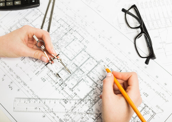 Architect working on blueprint