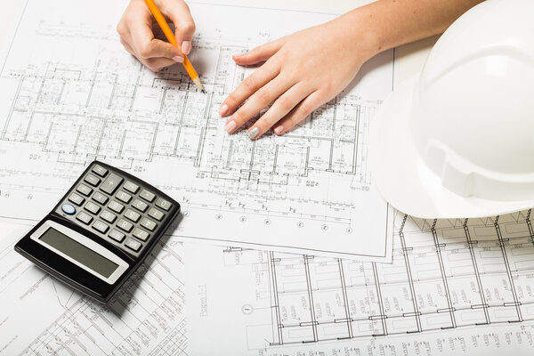 Architect working on blueprint