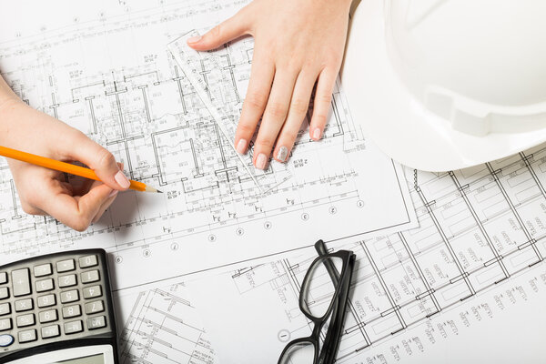 Architect working on blueprint