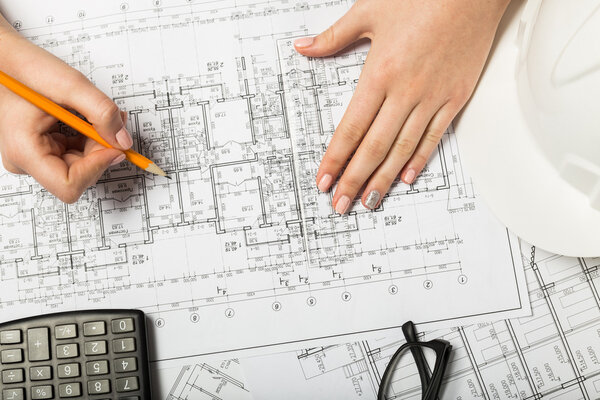 Architect working on blueprint