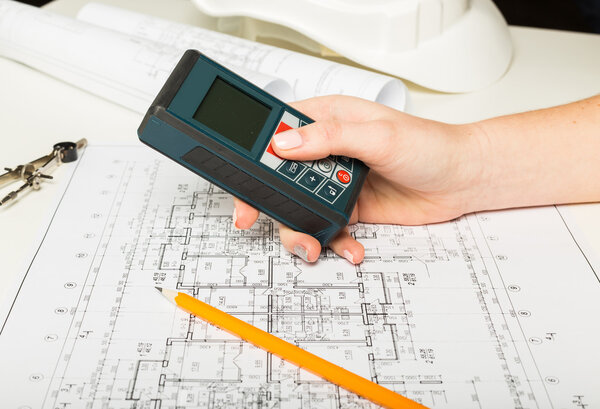 Architect working on blueprint