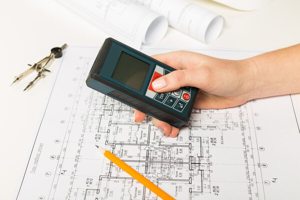 Architect working on blueprint