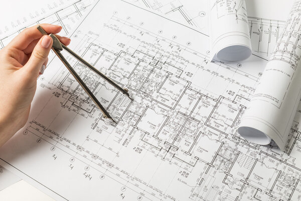 Architect working on blueprint