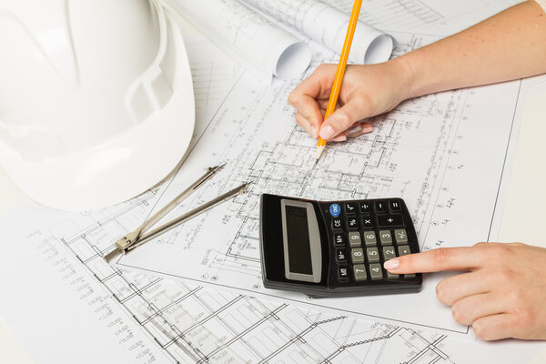 Architect working on blueprint