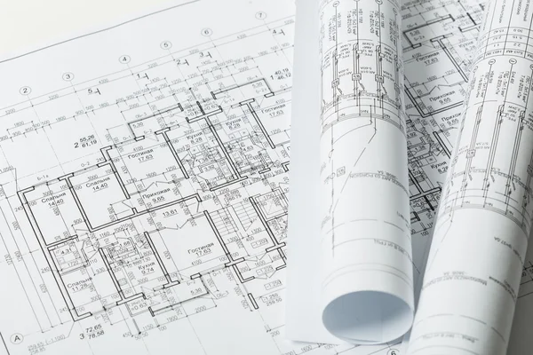 Byggbranschen arkitekturen rullar arkitektoniska planer projekt — Stockfoto