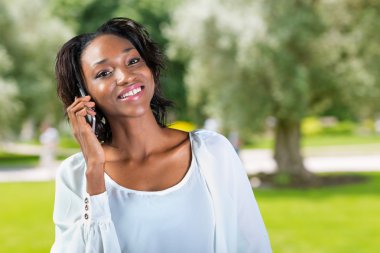 african woman talking on the phone