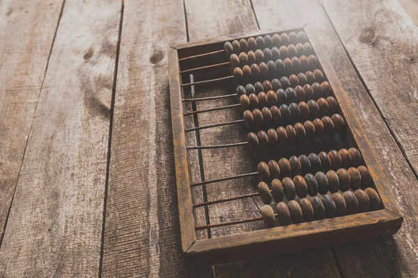 Abacus vintage sobre fondo de madera — Foto de Stock