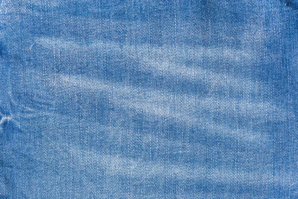 Calça jeans azul na superfície de madeira velha — Fotografia de Stock