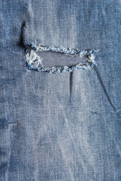Calça jeans azul na superfície de madeira velha — Fotografia de Stock