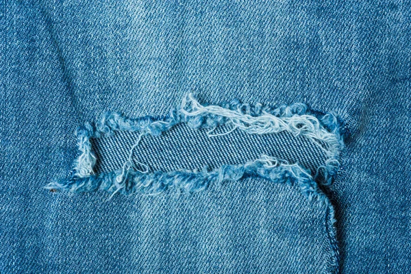 Jeans sobre fondo de madera — Foto de Stock