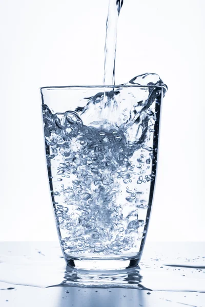Water splashing from glass — Stock Photo, Image