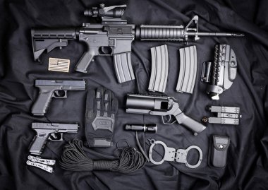 set of guns on black cloth clipart