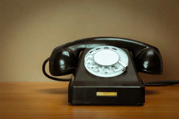 Retro telephone on table — Stock Photo, Image