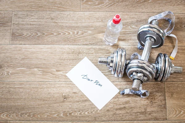 Weights and measuring tapes — Stock Photo, Image