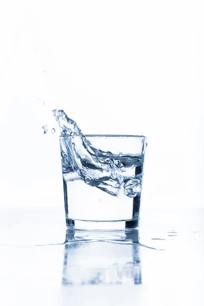 Water splashing from glass — Stock Photo, Image