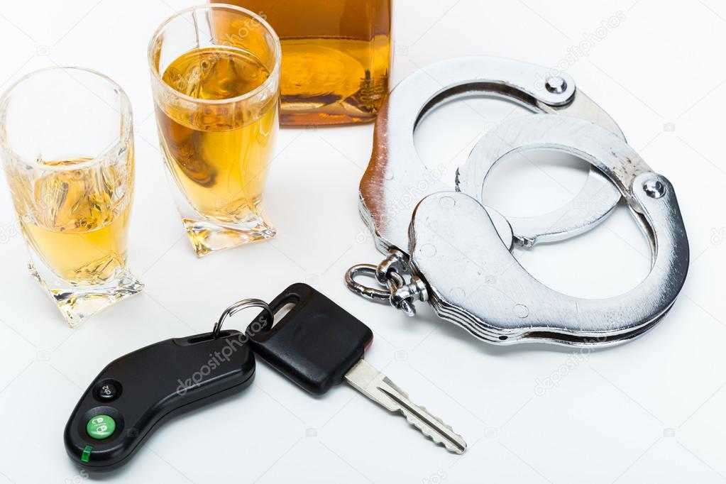 alcohol car keys and handcuffs