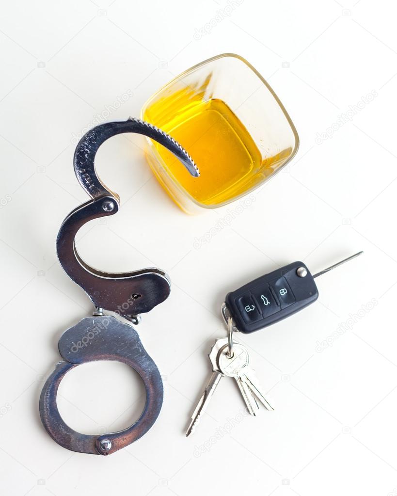 Drunk Driving Concept - Beer, Keys and Handcuffs