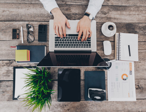 Businessman typing on laptop