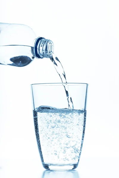 Glass and bottle of water — Stock Photo, Image