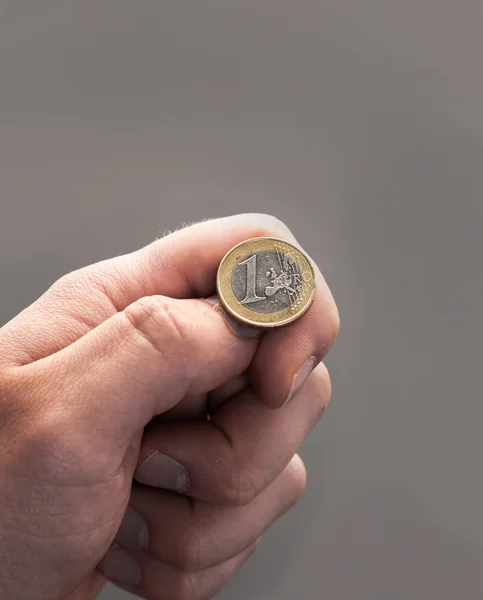 Hand Tossing Euro coin — Stock Photo, Image