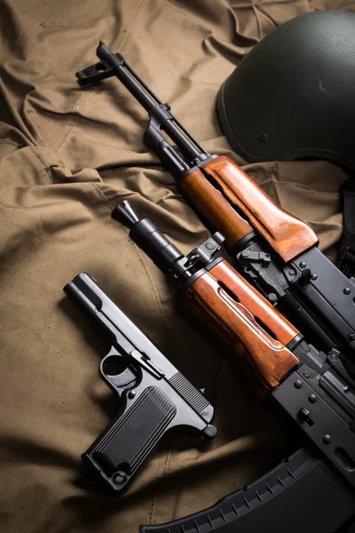 Tools and guns on cloth — Stock Photo, Image