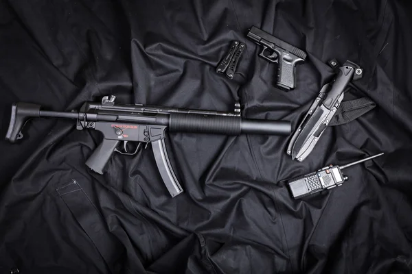 Set of guns on black cloth — Stock Photo, Image