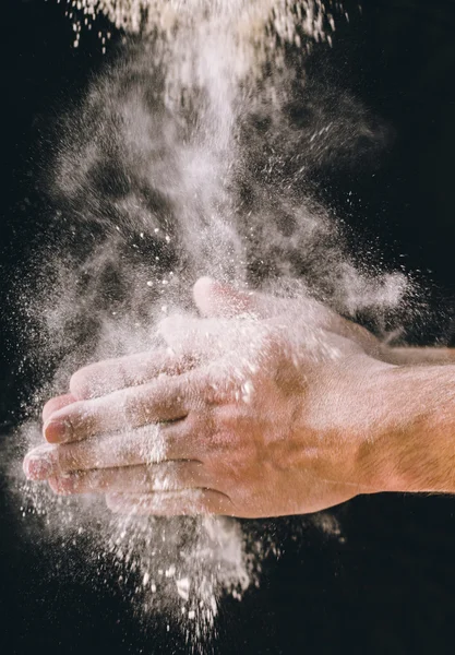 adult man hands work with flour