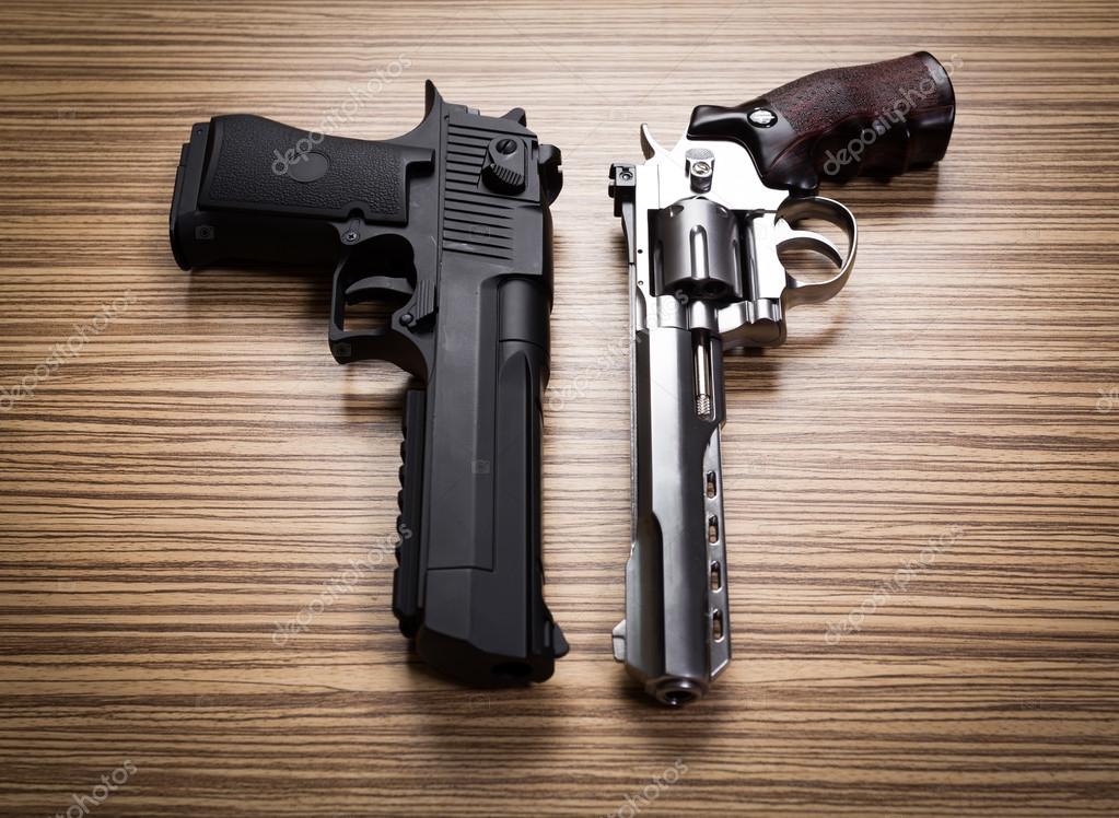 Two guns on wooden desk — Stock Photo © Fotofabrika 110699790