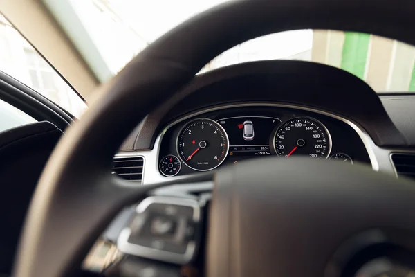 Modern car illuminated dashboard and steering wheel — Stock Photo, Image