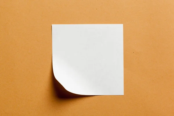 White paper card on orange background — Stock Photo, Image