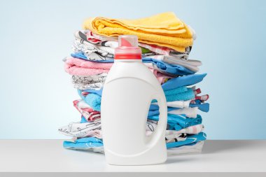 Colorful towels and liquid laundry detergent clipart