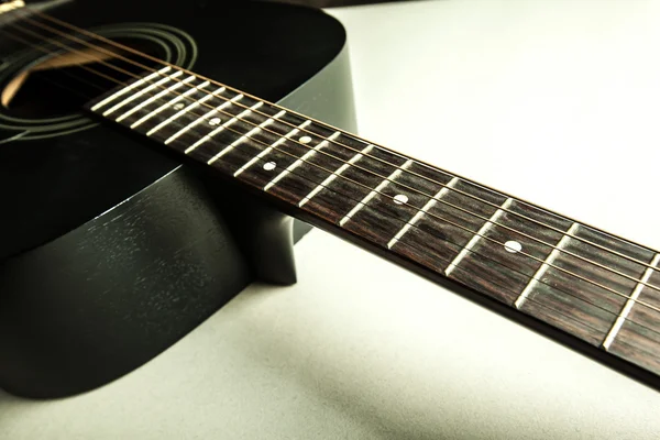 Classic black guitar body and neck detail — стоковое фото