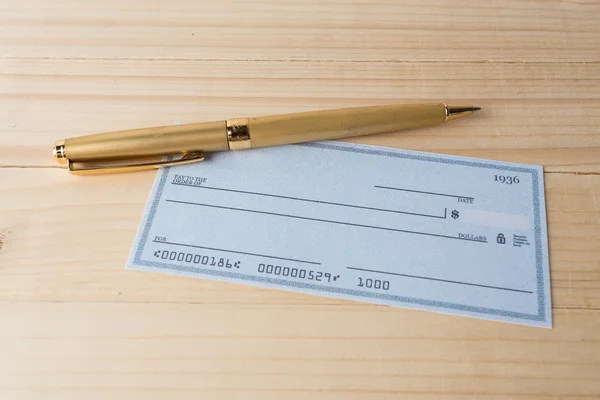 Ballponit pen and Banking Check — Stock Photo, Image