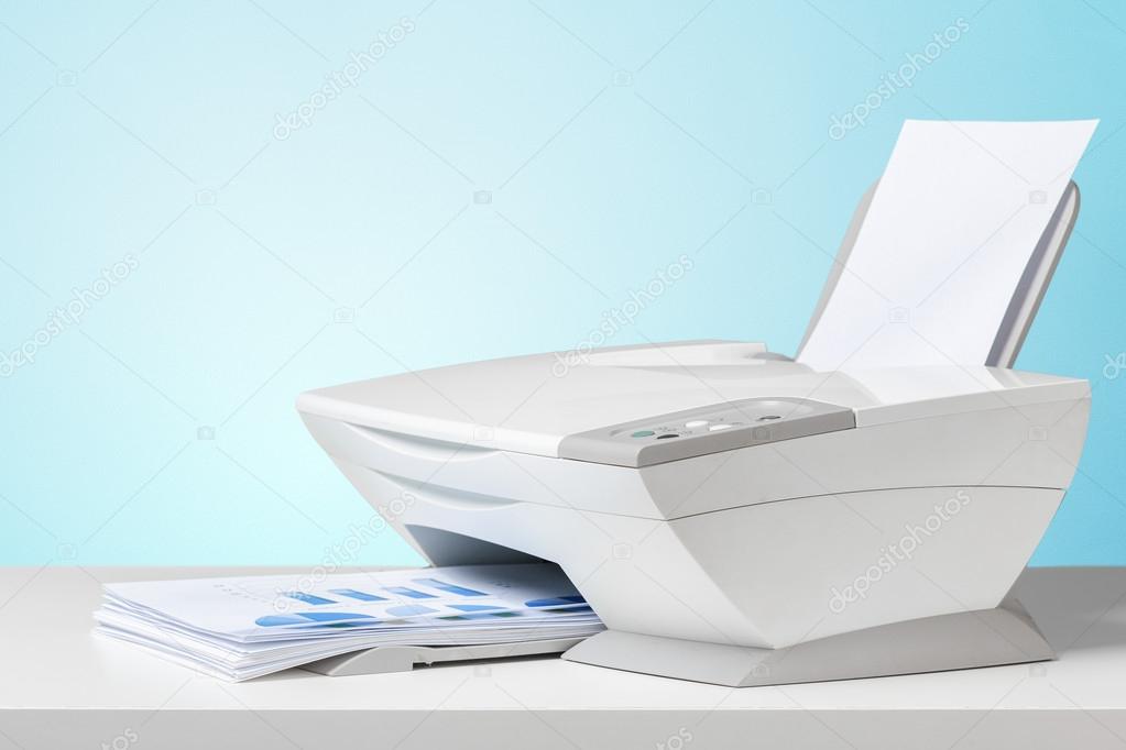 office Printer and stack of business papers