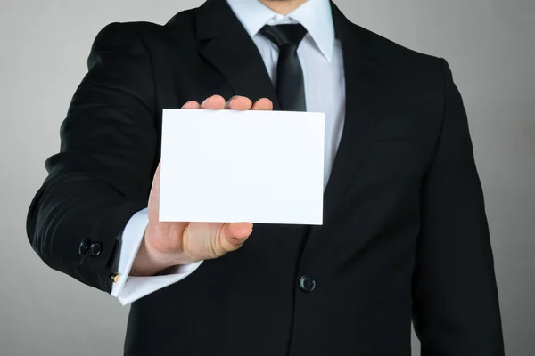 Businessman with business card — Stock Photo, Image