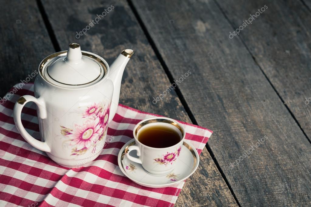 Teapot, tea cup and tablecloth Stock Photo by ©Fotofabrika 124190548
