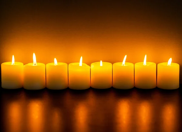 Burning candles in darkness — Stock Photo, Image